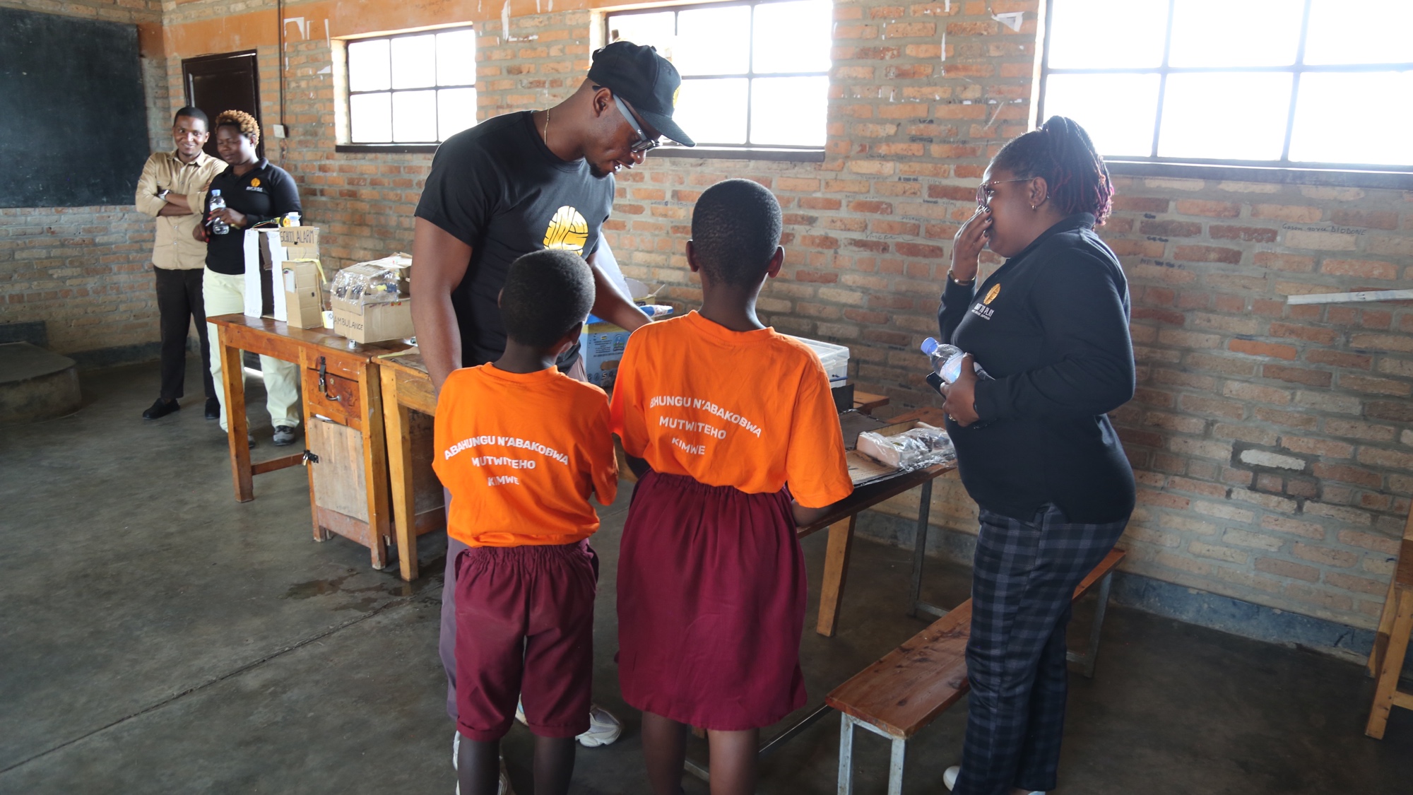 Duan Asemota with Right To Play students in Rwanda, November 2025