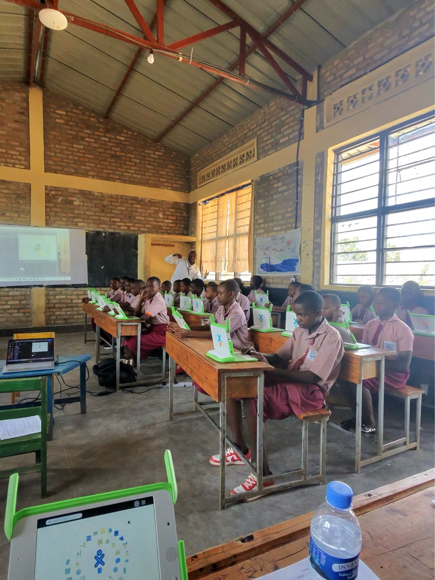 Students on laptops in a Plug in Play coding class in Ruhango, Rwanda