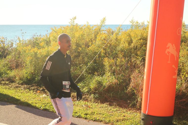 Runner passing the course marker