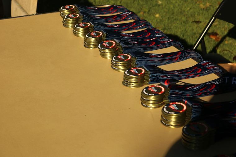 Finisher medals laid out on a table
