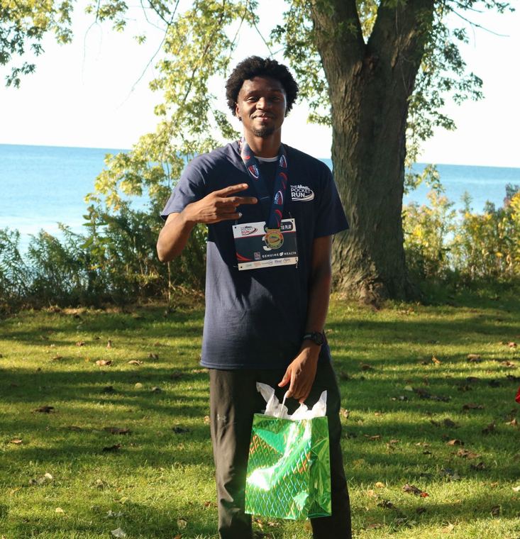 Finisher with a medal and gift bag