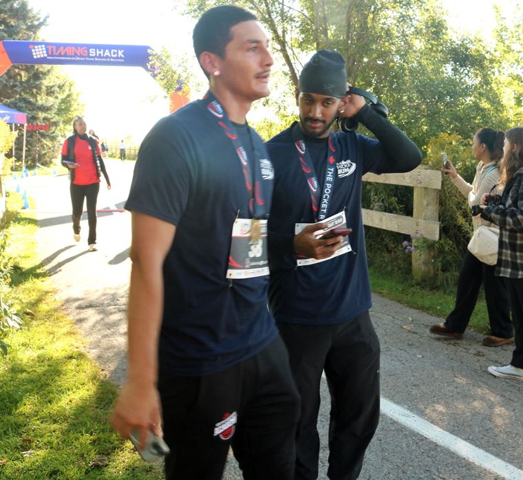 Two runners near the finish arch