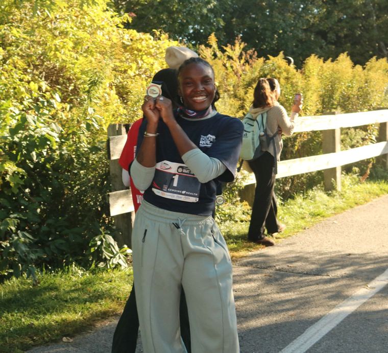 Runner with a medal and bib 1
