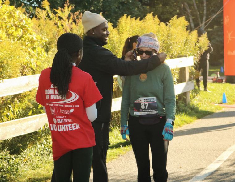 Volunteer and finisher after the race