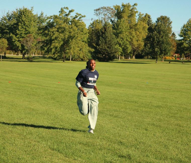 Runner sprinting across the field